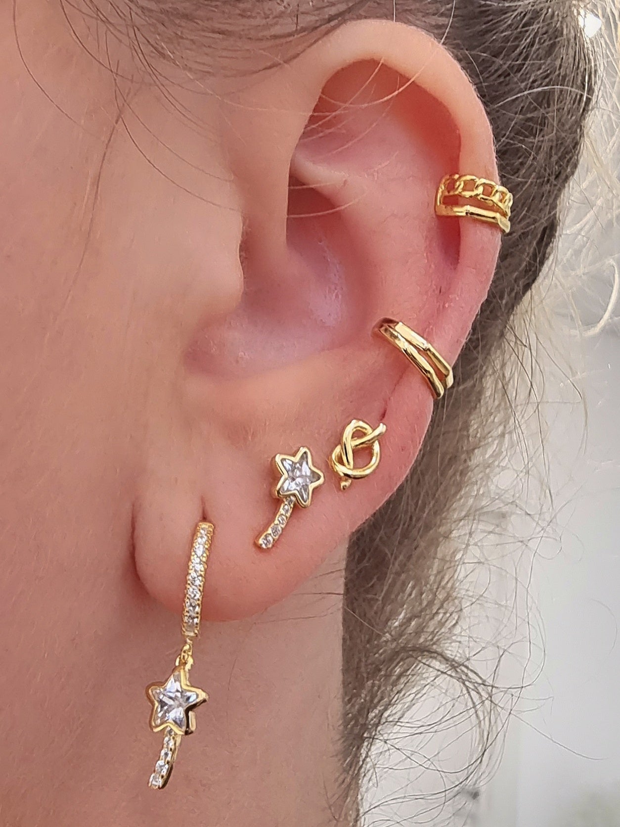 Silver huggie earrings with magic wand charms