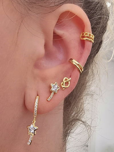 Silver huggie earrings with magic wand charms