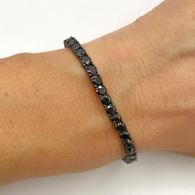 Silver casting tennis bracelet with black round stones