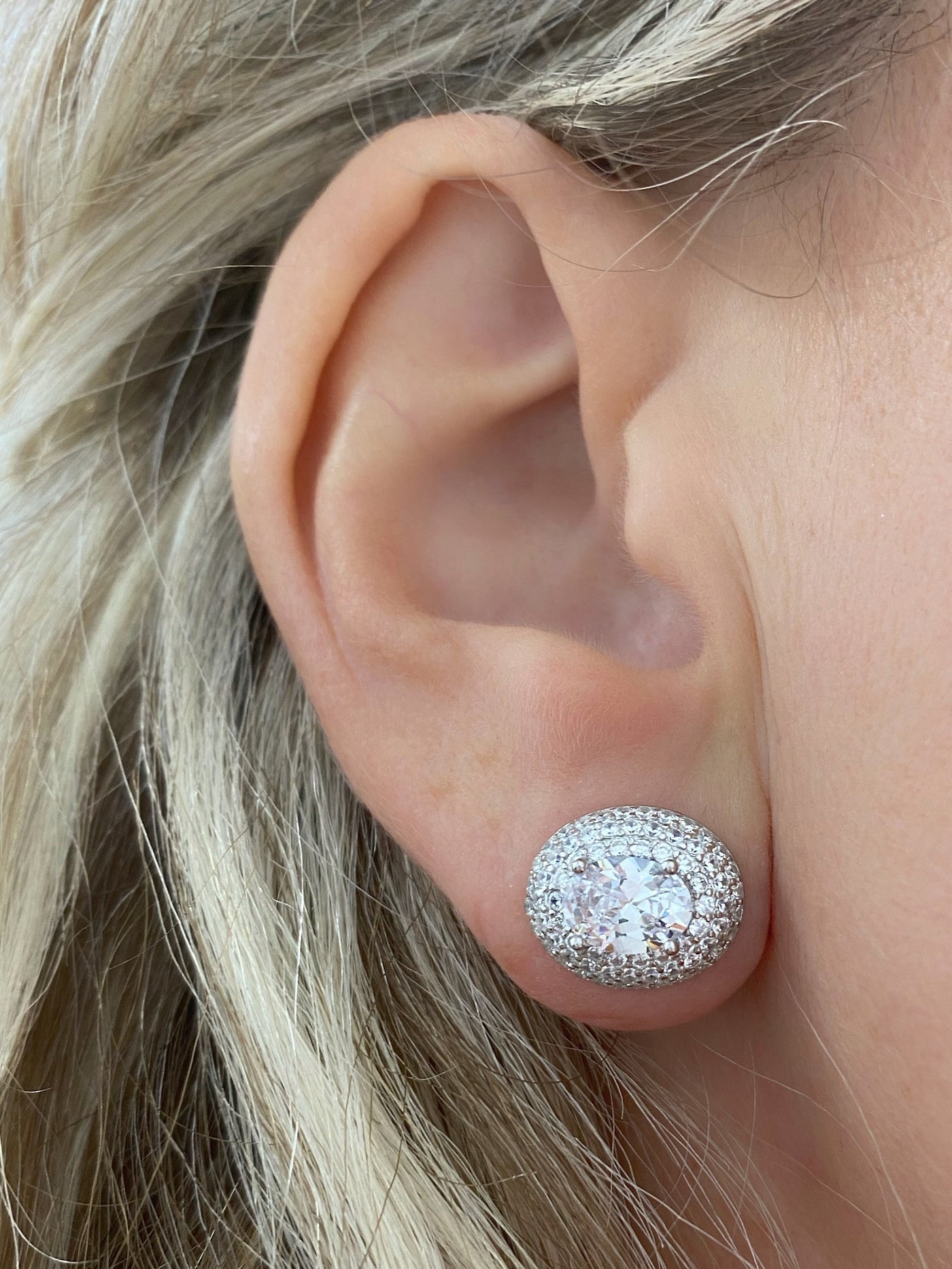 Silver earrings with oval zirconia stone