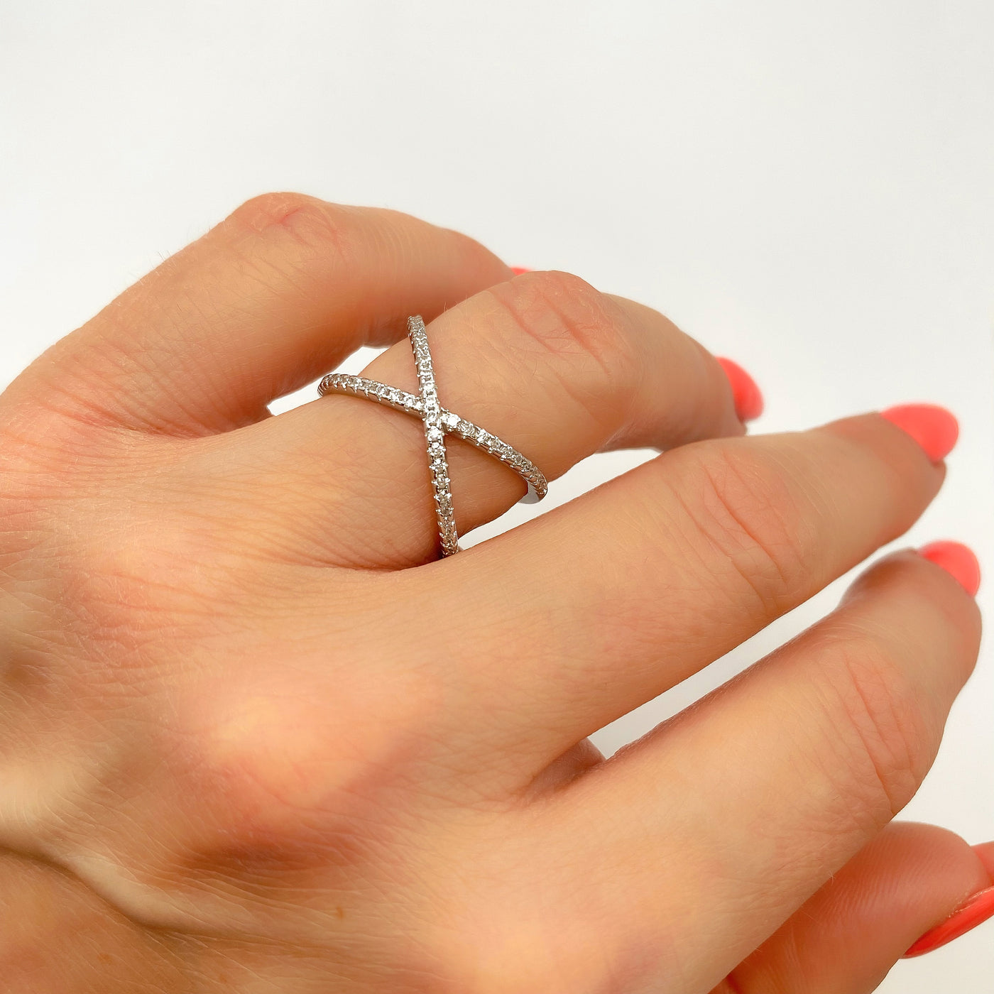 Silver crossed ring with zirconia